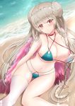  1girl azur_lane beach bikini blue_bikini blush braid breasts cleavage day double_bun eyebrows_visible_through_hair formidable_(azur_lane) formidable_(the_lady_of_the_beach)_(azur_lane) highres koda_(k-works) large_breasts long_hair looking_at_viewer looking_up navel ocean red_eyes sidelocks single_thighhigh sitting solo swimsuit thighhighs very_long_hair 