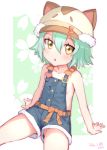 1girl animal_ears animal_hat artist_name bosshi cacao_(nekopara) cat_ears cat_hat cat_tail collarbone commentary_request cowboy_shot dated floral_background green_background green_hair hat highres looking_at_viewer naked_overalls nekopara overall_shorts overalls short_hair shorts sitting solo tail two-tone_background yellow_eyes 