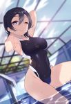  1girl ;) absurdres arms_behind_head arms_up bangs black_eyes black_hair black_swimsuit blurry blurry_background breasts closed_mouth commentary_request competition_swimsuit day depth_of_field dutch_angle highleg highleg_swimsuit highres indoors looking_at_viewer love_live! love_live!_sunshine!! medium_breasts medium_hair one-piece_swimsuit one_eye_closed pool revision smile solo swimsuit thighs wading watanabe_tsuki water wet wet_hair yamaori_(yamaorimon) 