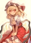  1girl ascot bangs blonde_hair closed_mouth eyebrows_visible_through_hair flandre_scarlet fuupu hat highres mob_cap puffy_short_sleeves puffy_sleeves red_eyes short_hair short_sleeves sitting smile solo touhou white_headwear wings yellow_background yellow_neckwear 