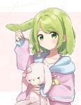  1girl animal_ears bangs blush bow braid bunny_ears green_eyes green_hair hair_bow highres holding holding_stuffed_animal kemonomimi_mode long_sleeves medium_hair morinaka_kazaki nijisanji pink_bow pink_hoodie sleeves_past_wrists solo stuffed_animal stuffed_bunny stuffed_toy virtual_youtuber yuama_(drop) 