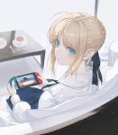  1girl ahoge aqua_eyes artoria_pendragon_(all) bangs blonde_hair braid coffee_table couch cup doubutsu_no_mori dress eyebrows_visible_through_hair fate/stay_night fate_(series) from_behind hair_ribbon holding_handheld_game_console looking_at_viewer nintendo_switch playing ribbon saber saucer sitting solo spoon table tea teacup wanke white_background 