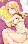  1girl aqua_eyes ayase_eli blonde_hair blue_bow blue_panties blush bow bow_panties breasts closed_mouth eyebrows_visible_through_hair highres large_breasts long_hair looking_at_viewer love_live! love_live!_school_idol_project lying mogu_(au1127) on_side panties pillow pillow_hug pout solo underwear 