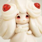  3d alcremie closed_mouth commentary creature english_commentary food fruit gen_8_pokemon highres no_humans photorealistic pokemon pokemon_(creature) realistic red_eyes sebastian_montecinos solo strawberry upper_body white_theme 