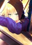  1girl ahoge arm_rest artoria_pendragon_(all) blonde_hair blush braid capsule_servant classroom closed_mouth commentary crossed_arms crown_braid desk dusk eyebrows_visible_through_hair fate/hollow_ataraxia fate_(series) green_eyes hair_between_eyes indoors long_sleeves looking_at_viewer master_artoria miruto_netsuki red_neckwear sailor_collar school_uniform serafuku shade short_hair sitting solo sunlight weapon_bag 