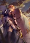  1girl armor armored_dress banner black_legwear blonde_hair blue_dress blue_eyes blurry_foreground breasts breasts_apart chain cloud dress fate/apocrypha fate_(series) faulds floating_hair from_below gauntlets headpiece holding jeanne_d&#039;arc_(fate) jeanne_d&#039;arc_(fate)_(all) long_dress long_hair medium_breasts outdoors sakusaku sheath sheathed shiny shiny_hair shiny_skin side_slit solo standing sword thighhighs very_long_hair weapon 