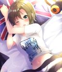  1girl bangs bed_sheet brown_hair eyebrows_visible_through_hair from_above green_eyes hair_between_eyes headphones headphones_removed idolmaster idolmaster_cinderella_girls idolmaster_cinderella_girls_starlight_stage looking_at_viewer lying midriff navel on_back one_eye_closed open_mouth print_shirt rocomani shiny shiny_hair shirt short_hair short_sleeves solo stomach tada_riina under_covers union_jack white_shirt 