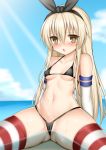  1girl bikini black_hairband blonde_hair blue_sky breasts brown_eyes cloud collarbone day eyebrows_visible_through_hair hair_between_eyes hairband kantai_collection light_rays long_hair looking_at_viewer micro_bikini navel ocean open_mouth outdoors shimakaze_(kantai_collection) sitting sky small_breasts solo striped striped_legwear sunbeam sunlight swimsuit thighhighs toshishikisai wet 