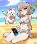  1girl :o backpack bag bare_shoulders barefoot beach bikini blurry blurry_background bow breasts brown_hair centinel303 cleavage collarbone danganronpa_(series) danganronpa_2:_goodbye_despair ear_bow flipped_hair galaga grey_bikini hair_ornament handheld_game_console heart highres holding holding_handheld_game_console large_breasts medium_hair mole mole_on_breast nanami_chiaki navel nintendo_switch ocean official_alternate_costume pink_bow sand stomach swimsuit teeth upper_teeth_only usami_(danganronpa) wings 