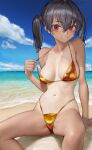  1girl absurdres beach bikini bikini_top_pull black_hair blue_sky breasts gold_bikini grin hair_between_eyes highres long_hair looking_at_viewer medium_breasts navel nyatabe ocean original outdoors pulled_by_self red_eyes sitting sky smile solo spread_legs swimsuit tan tanlines twintails veins veiny_breasts wet 