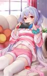  1girl absurdres ahoge commission couch embarrassed fur_trim hair_rings highres indoors ion_(on01e) long_hair long_sleeves looking_at_viewer matoi_(pso2) navel nintendo_switch pajamas phantasy_star phantasy_star_online_2 pink_pajamas pink_shorts pixiv_commission red_eyes scrunchie shorts sunlight thighhighs twintails very_long_hair white_thighhighs window wrist_scrunchie zettai_ryouiki 