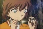  1girl anime_screenshot aoyama_goushou black-framed_eyewear brown_hair close-up closed_mouth crossed_bangs glint green_eyes haibara_ai highres holding holding_removed_eyewear jacket lens_flare light_smile looking_at_object meitantei_conan meitantei_conan_kurogane_no_submarine official_art orange_jacket outdoors portrait rock shirt short_hair solo unworn_eyewear wavy_hair weeds white_shirt 