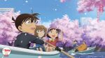  2girls 3boys :d anime_coloring balancing black-framed_eyewear black_hair black_jacket black_pants blue_dress blue_eyes blue_pants boat bow bowtie brown_hair building canal cherry_blossoms closed_mouth copyright_logo copyright_notice day dress edogawa_conan falling_petals glasses green_eyes grey_shorts haibara_ai hairband highres holding holding_oar index_finger_raised jacket kojima_genta long_sleeves looking_up meitantei_conan multiple_boys multiple_girls oar official_art on_boat open_mouth orange_shirt outdoors pants petals pink_hairband pink_petals pointing pointing_up red_shirt rowboat rowing shirt short_hair short_sleeves shorts sitting smile tsuburaya_mitsuhiko water watercraft white_shorts yellow_bow yellow_bowtie yoshida_ayumi 