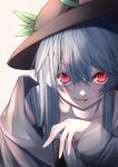  1girl :p beige_background black_headwear blue_hair collarbone fall_dommmmmer food fruit hair_between_eyes hair_over_eyes hat highres hinanawi_tenshi long_hair looking_at_viewer peach red_eyes smile solo tongue tongue_out touhou upper_body 
