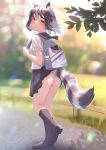  1girl alternate_costume animal_ear_fluff animal_ears ass bag bare_arms black_hair blurry blurry_background brown_eyes closed_mouth common_raccoon_(kemono_friends) contemporary day extra_ears fennec_(kemono_friends) floating_hair from_side full_body grey_hair highres japari_symbol kemono_friends kneepits looking_at_viewer medium_hair multicolored_hair no_panties outdoors pleated_skirt raccoon_ears raccoon_tail sailor_collar school_bag school_uniform shirt shoes short_sleeves skirt skirt_lift smile socks solo st.takuma tail tail_lift walking white_hair wind 