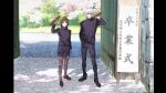  1boy 1girl black_jacket black_pantyhose black_shirt black_shoes brown_hair cherry_blossoms commentary_request copyright_notice diploma diploma_tube full_body gate gojou_satoru graduation hand_in_pocket hand_up highres holding holding_diploma ieiri_shoko jacket jujutsu_kaisen jujutsu_tech_uniform looking_at_viewer official_art pantyhose pencil_skirt pillarboxed round_eyewear shirt shoes short_hair skirt standing studio_mappa tinted_eyewear translation_request white_hair 