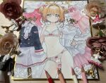  1girl absurdres antenna_hair art_tools_in_frame bra breasts brown_hair cardcaptor_sakura colored_pencil_(medium) commentary_request dress green_eyes highres holding holding_unworn_clothes kinomoto_sakura lingerie looking_at_viewer mosho panties photo_(medium) school_uniform shikishi short_hair skirt small_breasts solo tomoeda_middle_school_uniform traditional_media two_side_up underwear unworn_dress 
