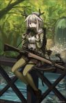 1girl absurdres antlers arknights arrow_(projectile) black_footwear black_gloves black_skirt bow_(weapon) breasts bridge covered_mouth crossbow day firewatch_(arknights) forest full_body gloves green_jacket green_legwear grey_hair hands_up highres holding jacket long_sleeves nature ndtwofives on_railing open_clothes open_jacket outdoors pantyhose pleated_skirt ponytail reindeer_antlers river shirt shoes sitting sitting_on_railing skirt small_breasts sniper_scope solo twitter_username water waterfall weapon white_shirt 