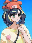  1girl absurdres asatte_3z beanie black_hair blue_background collarbone ears_visible_through_hair floral_print green_eyes hand_up hat highres pokemon pokemon_sm red_hat selene_(pokemon) short_hair solo swept_bangs upper_body 