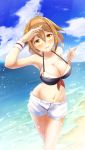  1girl arm_up beach bikini black_bikini blue_sky breasts brown_eyes brown_hair cleavage cloud commentary_request day feet_out_of_frame hairband highres kantai_collection large_breasts looking_at_viewer navel orange_hairband outdoors shading_eyes shiratsuyu_(kantai_collection) short_hair short_shorts shorts sky solo standing swimsuit white_shorts wristband yomitsuna 