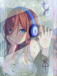  1girl blue_eyes blush breasts brown_hair closed_mouth commentary_request go-toubun_no_hanayome hair_between_eyes hand_on_own_cheek hand_on_window headphones highres indoors large_breasts long_hair looking_outside nakano_miku off_shoulder rain ribbed_shirt shirt sleeveless sleeveless_shirt slime07 turtleneck water_drop window 