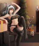  1girl animal_ears arknights arm_up bandeau bangs bare_arms bare_shoulders black_legwear black_shorts blurry blurry_background box breasts brown_eyes cat_ears ceylon_(arknights) chair character_doll christmas_tree commentary_request feet_out_of_frame garter_straps gift gift_box hair_between_eyes highres indoors long_hair medium_breasts micro_shorts midriff navel no_shoes schwarz_(arknights) shorts silver_hair sitting solo stomach strapless thighhighs thighs tubetop zhi_wozi 