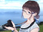  1girl aqua_eyes blurry blurry_background bracelet brown_hair camera earrings from_side glasses highres holding holding_camera jewelry looking_at_viewer mole mole_under_mouth nail_polish original outdoors portrait saitou_(lynx-shrike) short_hair solo watch wristwatch 