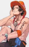  1boy absurdres arm_tattoo black_hair black_shorts bracelet elbow_pads flower freckles hat hibiscus highres jewelry kameoka908 log_pose looking_at_viewer male_focus necklace one_piece orange_hat pearl_necklace portgas_d._ace pouch shorts simple_background single_elbow_pad smile solo tattoo thigh_pouch topless_male twitter_username 
