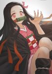  1girl absurdres beige_background black_hair black_haori devil_lo feet_out_of_frame fingernails gag highres japanese_clothes kamado_nezuko kimetsu_no_yaiba kimono long_fingernails long_hair looking_at_viewer multicolored_hair nail_polish obi pink_eyes pink_nails red_eyes red_hair ribbon sash solo two-tone_hair very_long_hair 