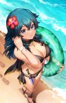  1girl beach bikini black_bikini blue_eyes blue_hair breasts byleth_(fire_emblem) byleth_(fire_emblem)_(female) cleavage closed_mouth dagger fire_emblem fire_emblem:_three_houses fire_emblem_heroes flower hair_flower hair_ornament highres holding innertube kaze-hime outdoors sheath sheathed smile solo swimsuit water weapon 