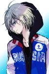  1boy black_shirt blonde_hair blue_background clothes_writing commentary copyright_name green_eyes hood hood_up hoodie jacket looking_at_viewer open_clothes open_jacket shirt sketch solo sugano_manami track_jacket two-tone_background upper_body white_background yuri!!!_on_ice yuri_plisetsky 