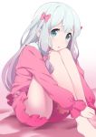  1girl barefoot blue_eyes bow commentary_request eromanga_sensei feet izumi_sagiri knees_on_chest knees_up leg_hug legs long_hair misashi_(raichi821) open_mouth pink_shirt pink_shorts ribbon shirt short_shorts shorts silver_hair simple_background sitting sleepwear solo thighs white_background 