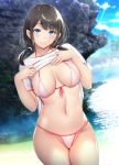  1girl bangs beach bikini black_hair blue_eyes blush breasts cleavage closed_mouth commentary_request cowboy_shot eyebrows_visible_through_hair gentsuki groin hands_on_own_chest highres large_breasts lifted_by_self light_rays long_hair looking_at_viewer low_twintails navel ocean original rock shirt_lift short_sleeves skindentation smile solo stomach sunbeam sunlight swimsuit twintails water white_bikini 