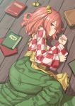  1girl apron bell book checkered checkered_kimono green_skirt hair_bell hair_ornament highres isemori japanese_clothes kimono long_sleeves looking_at_viewer lying medium_hair motoori_kosuzu on_floor on_side profile red_eyes red_hair skirt solo touhou wide_sleeves wooden_floor 