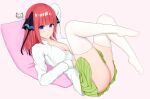  1girl absurdres arm_behind_head ass bangs black_ribbon blue_eyes blunt_bangs blush breasts butterfly_hair_ornament cleavage feet go-toubun_no_hanayome green_skirt hair_ornament highres knees_up large_breasts long_sleeves lying nakano_nino nya_cot on_back partially_unbuttoned pillow pink_background pink_hair ribbon shirt simple_background skirt thick_thighs thighhighs thighs twintails v-shaped_eyebrows white_legwear white_shirt zettai_ryouiki 