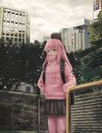  1girl a9x3 backpack bag black_skirt bocchi_the_rock! building chain-link_fence cloud cloudy_sky commentary day fence gotoh_hitori grey_eyes grey_sky highres jacket long_sleeves outdoors painterly pants pink_hair pink_jacket pink_pants scenery skirt sky skyscraper solo tree turtleneck turtleneck_jacket urban 