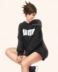  1girl black_nails brown_eyes brown_hair casual crossed_legs hood hood_down hoodie invisible_chair jewelry lips overwatch ring short_hair sitting smile solo spiked_hair tracer_(overwatch) twitter_username umigraphics zipper_pull_tab 