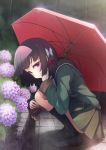  1girl bangs black_hair black_legwear blush bow eyebrows_visible_through_hair flower green_jacket green_sailor_collar green_skirt hair_bow hydrangea ishigaki_(kantai_collection) jacket kantai_collection kneehighs long_sleeves mofu_namako outdoors pleated_skirt pom_pom_(clothes) purple_eyes rain red_bow sailor_collar school_uniform short_hair skirt smile solo squatting umbrella white_bow 