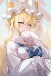  1girl animal_ears bangs blonde_hair breasts dress fox_ears fox_tail frills hat highres holding homo_1121 multiple_tails pillow_hat short_hair solo tabard tail tassel touhou upper_body white_dress white_headwear wide_sleeves yakumo_ran yellow_eyes 