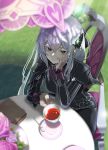  1girl :&gt; absurdres arm_support bangs black_capelet black_dress book breasts butterfly_hair_ornament capelet chair closed_mouth commentary crossed_bangs cup day dress echidna_(re:zero) flower from_above grass grey_hair hair_ornament hand_on_own_cheek highres holding holding_cup jsih long_hair long_sleeves looking_at_viewer medium_breasts outdoors pink_flower re:zero_kara_hajimeru_isekai_seikatsu shadow sitting smile solo spoon table teacup teaspoon 