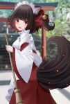  1girl absurdres animal_ear_fluff animal_ears bamboo bell black_hair blurry blurry_background bow broom colored_inner_hair commentary_request depth_of_field from_behind hair_bell hair_bow hair_ornament hakama hakama_skirt highres holding holding_broom japanese_clothes jingle_bell kimono long_sleeves looking_at_viewer looking_back miko multicolored_hair one_side_up original red_bow red_eyes red_hair red_hakama sapphire_(sapphire25252) skirt solo stairs stone_stairs tail white_kimono wide_sleeves 