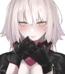  1girl black_gloves black_jacket blush box breasts cleavage closed_mouth fate/grand_order fate_(series) gift gift_box gloves grey_hair hands_up heart-shaped_box highres holding holding_gift jacket jeanne_d&#039;arc_alter_(fate) lips long_hair looking_at_viewer loose_hair_strand portrait ri_o_ne_su simple_background slit_pupils solo sweat valentine white_background yellow_eyes 