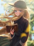  1girl bangs bible black_dress black_headwear blonde_hair bloom blue_eyes blurry blurry_background blurry_foreground book character_request closed_mouth day dress eyebrows_visible_through_hair floating_hair frown hat highres holding lens_flare long_hair long_sleeves looking_at_viewer milmir open_book outdoors solo standing sun_hat sunlight very_long_hair yuu-gi-ou 