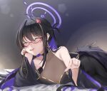  1girl ;d antenna_hair bare_shoulders black_dress black_hair breasts character_request cleavage closed_eyes commentary copyright_request dress english_commentary hair_between_eyes hair_intakes hair_ornament halo highres large_breasts lying on_stomach one_eye_closed purple_halo red-framed_eyewear red_eyes rin_(rin_rinno_) see-through_cleavage see-through_clothes semi-rimless_eyewear smile solo 