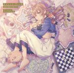  1girl ahoge barefoot black_cat brown_hair cake cat chess_piece chessboard coffee copyright_name cushion english_text food fork fujimi_nanna green_eyes green_ribbon hair_between_eyes hair_ribbon highres hug hugging_doll hugging_object long_hair long_sleeves looking_at_viewer lying monica_everett on_side one_eye_closed open_mouth ribbon silent_witch solo stuffed_toy teapot 