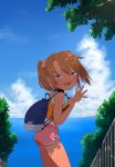  1girl absurdres backpack bag blue_eyes brown_hair camisole coffee-milk-moumou collar commentary day fang flower hair_flower hair_ornament highres looking_at_viewer ocean original outdoors shade short_shorts shorts sky solo tan tanline twintails waving yuma_(coffee-milk-moumou) 