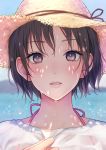  1girl bangs black_hair blurry blurry_background brown_eyes brown_headwear commentary_request daidai_jamu depth_of_field eyebrows_visible_through_hair hand_up hat highres looking_at_viewer ocean original parted_lips see-through shirt short_hair solo straw_hat summer sweat upper_body wet wet_clothes wet_shirt white_shirt 