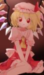  1girl arms_between_legs black_wings blonde_hair bonnet commentary_request fang flandre_scarlet highres hiyoko_(96823534) looking_at_viewer open_mouth red_eyes red_shirt red_skirt sailor_collar shirt skirt smile solo touhou white_bonnet white_sailor_collar wings 