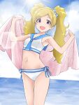  1girl :d bikini blonde_hair blue_sailor_collar breasts commentary_request cowboy_shot day emily_stewart highres holding holding_towel idolmaster idolmaster_million_live! long_hair looking_at_viewer matcha_kingyo navel open_mouth outdoors purple_eyes sailor_bikini sailor_collar sailor_swimsuit_(idolmaster) small_breasts smile solo standing sunlight swimsuit towel twintails water white_bikini 