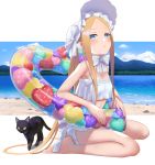  1girl abigail_williams_(fate/grand_order) abigail_williams_(swimsuit_foreigner)_(fate) bangs bare_shoulders beach bikini black_cat blonde_hair blue_eyes blue_sky blush bonnet bow breasts cat fate/grand_order fate_(series) forehead highres illyasviel_von_einzbern_(swimsuit_archer)_(fate) innertube legs long_hair looking_at_viewer multiple_bows open_mouth parted_bangs shore sidelocks sitting sky small_breasts swimsuit tsuchifumazu twintails very_long_hair wariza white_bikini white_bow white_headwear 